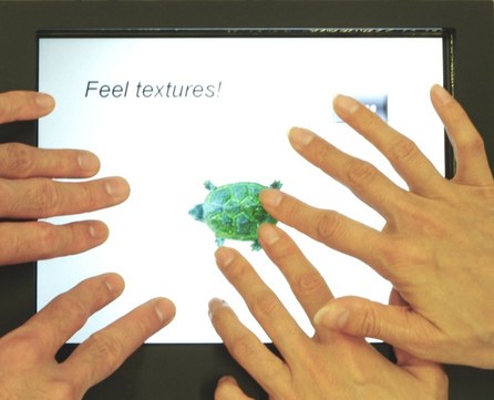 The new tactile touch display enables multiple users to individually feel the texture of the image they touch.